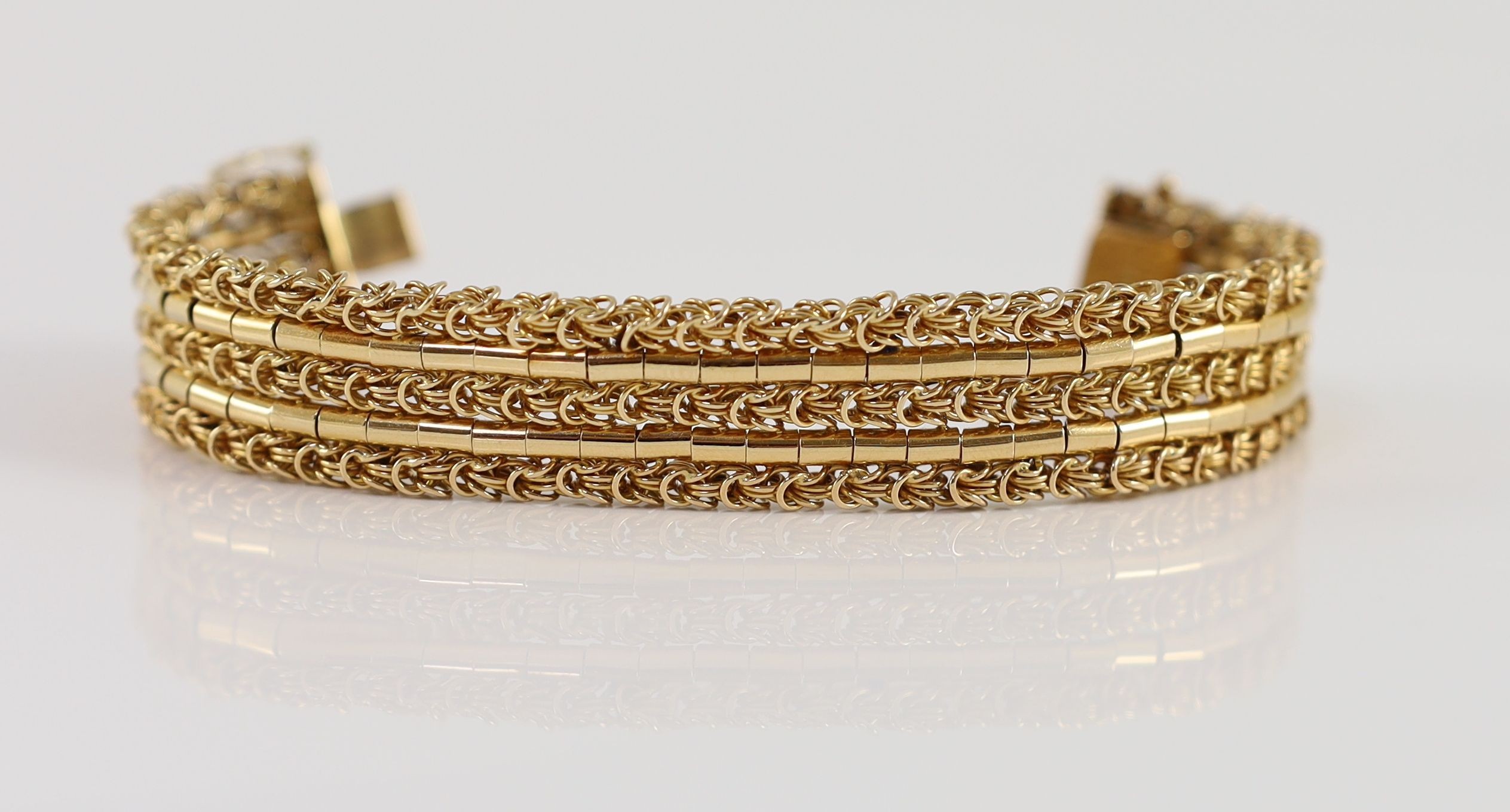 A 20th century 18k gold interwoven three row bracelet